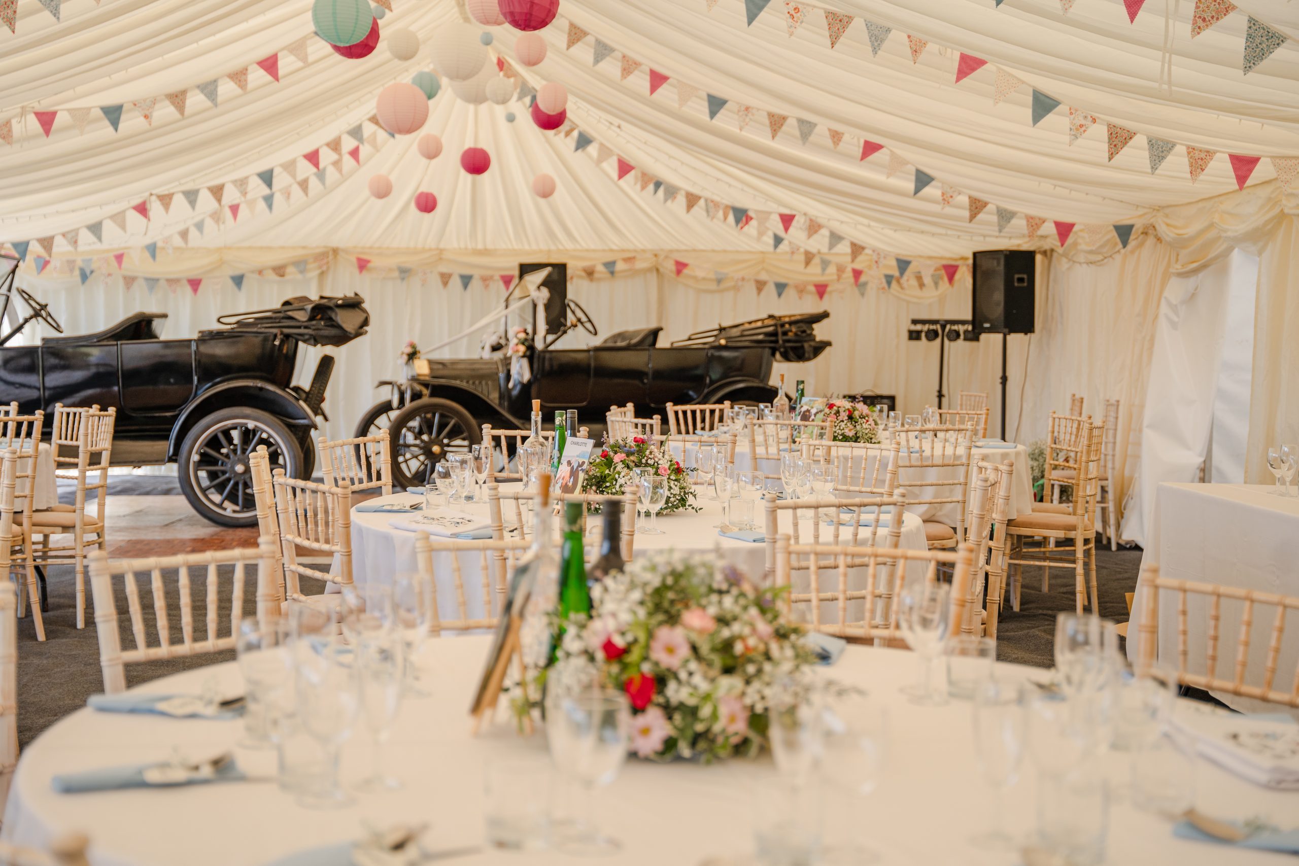 Marquee wedding with vintage cars